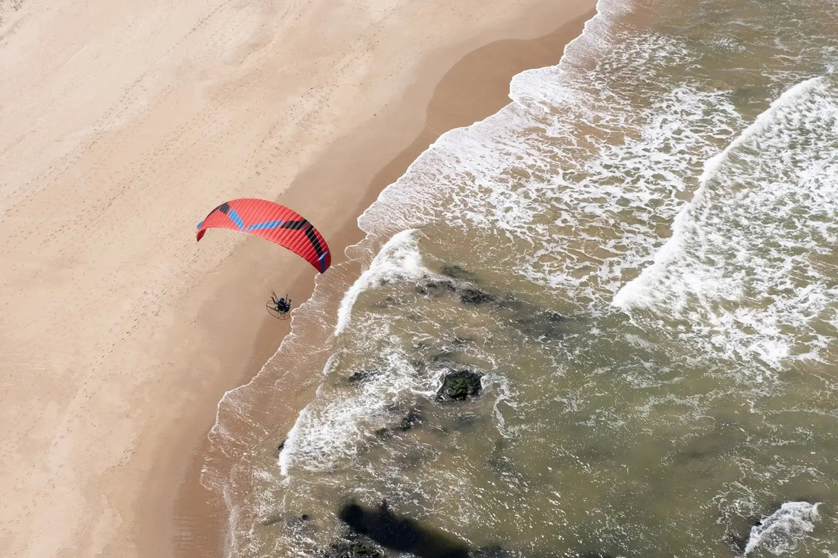 paragliding along the shore