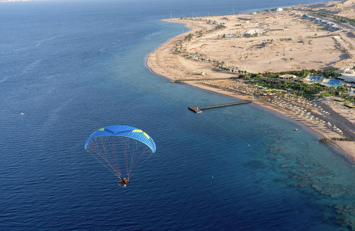 paramotoring over the sea by the coast