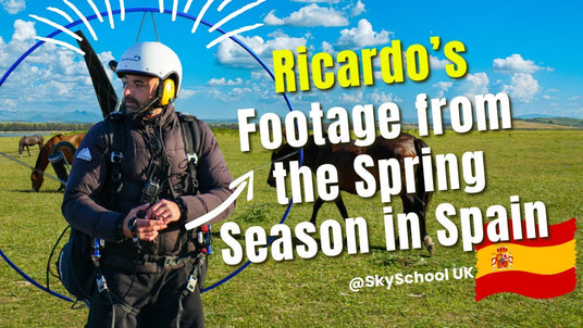 Person with paragliding equipment in a field with horses, text overlay about spring season in Spain.
