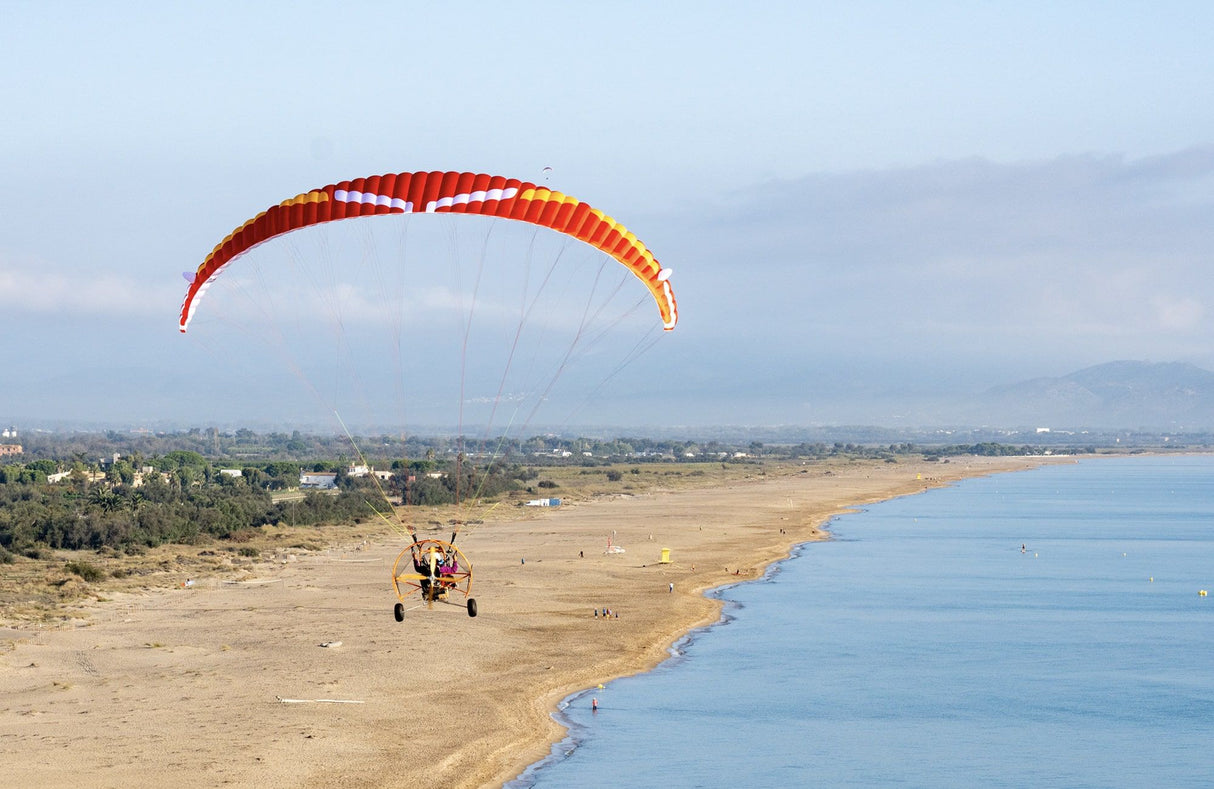 paratike flying along coastline