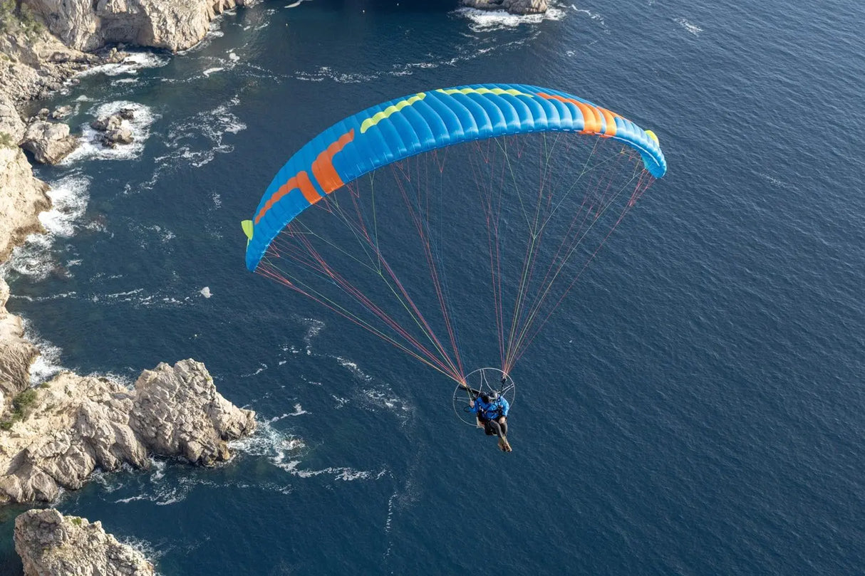 a paraglider over the coast