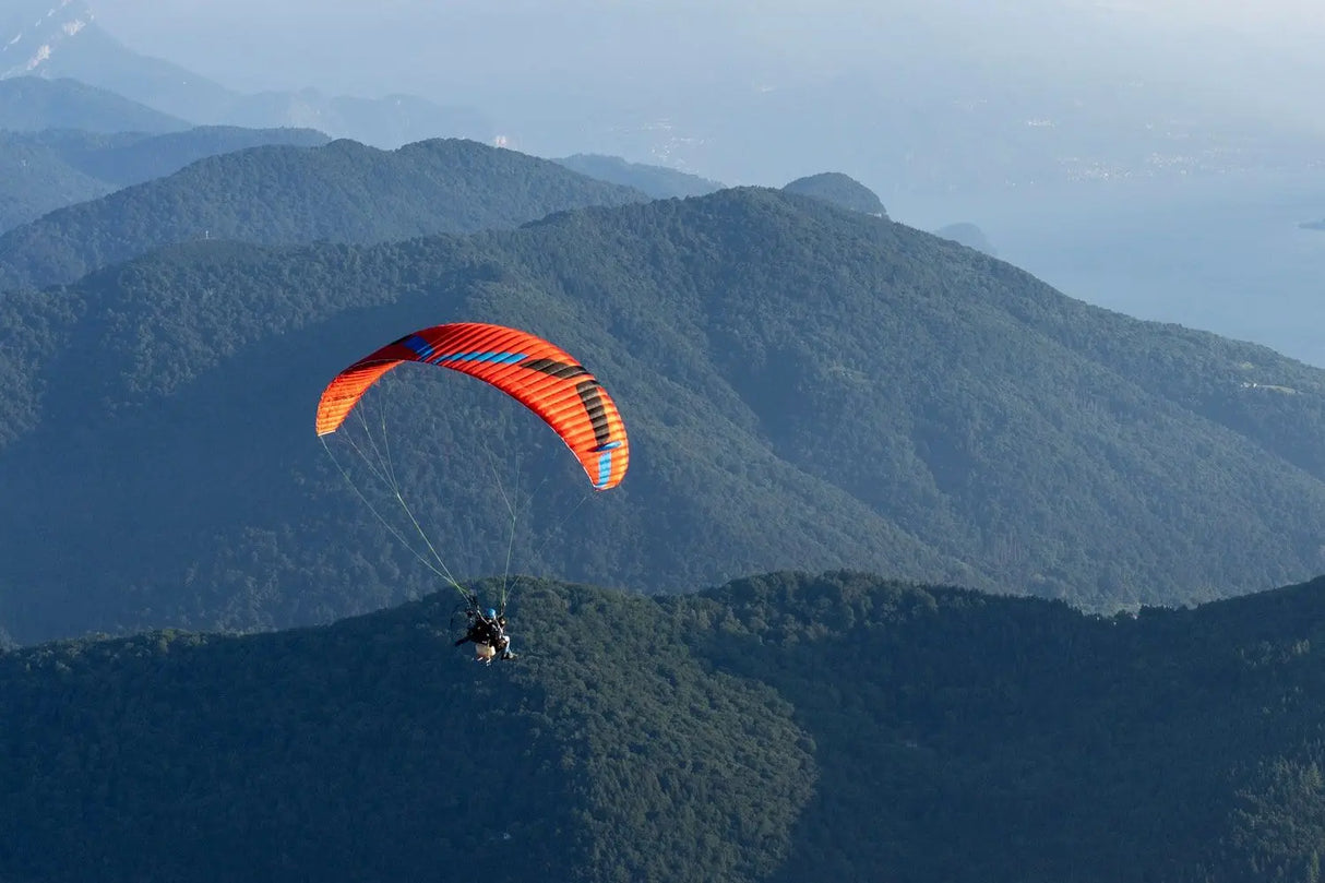 paragliding over hills