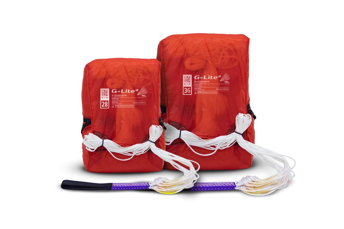 Two red G-Lite fire starters with a purple and black fire starter on a white background