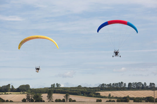 two people flying on the paramotor pilots course