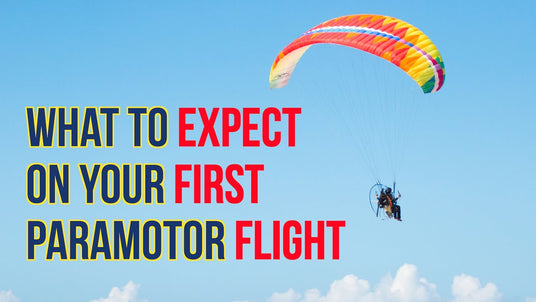 man in sky flying paramotor