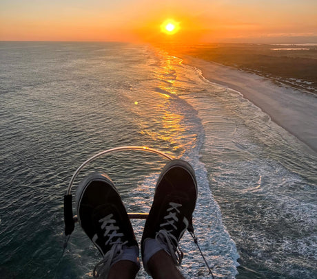 feet on Parajet above the sea