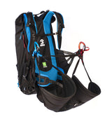 Black and blue NEO Shorty paramotor harness with straps on a white background