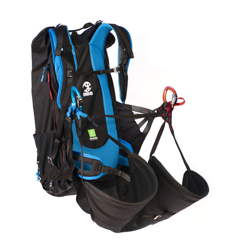 Black and blue NEO Shorty paramotor harness with straps on a white background