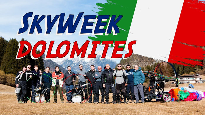 men posing with paramotors in the Dolomites