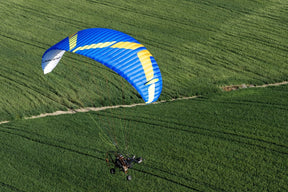 man flying ozone road max over field