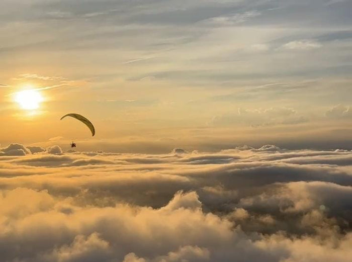 paragliding at sunset