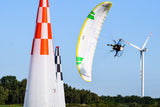 person flying a parajet around obstacles