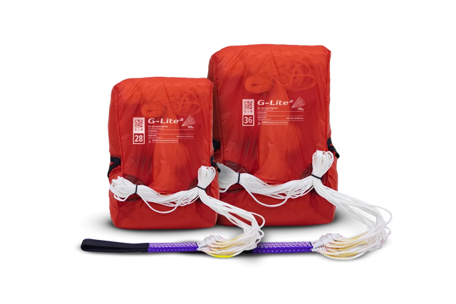 Two red G-Lite fire starters with a purple and black fire starter on a white background