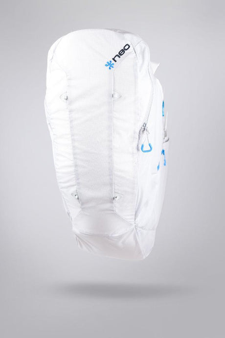 White backpack with blue branding on a gray background