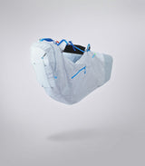 Light blue hand gliding harness pack with blue accents on a gray background