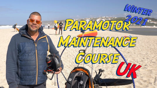 man with paramotor on beach on paramotor course
