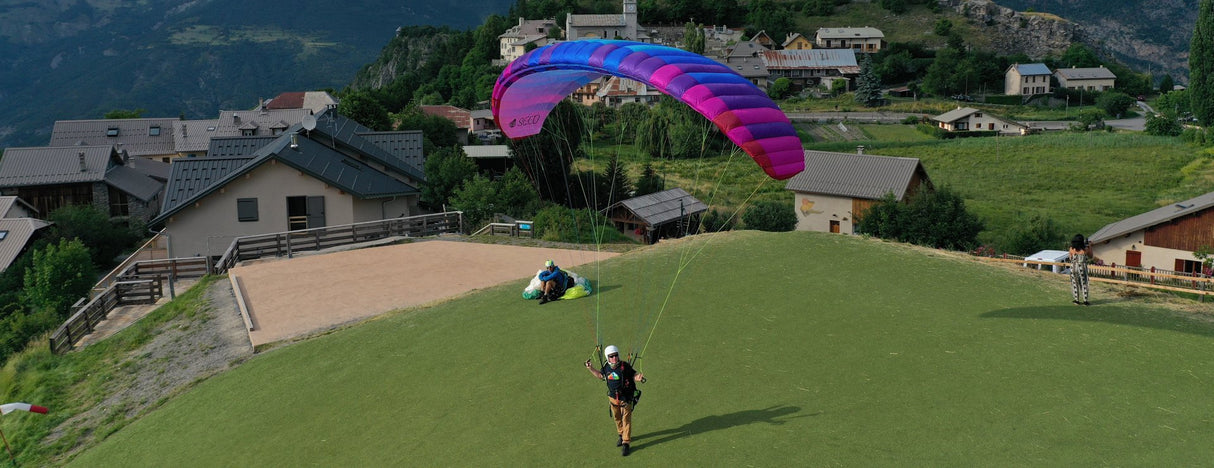 man standing with SEED - our premier training paraglider
