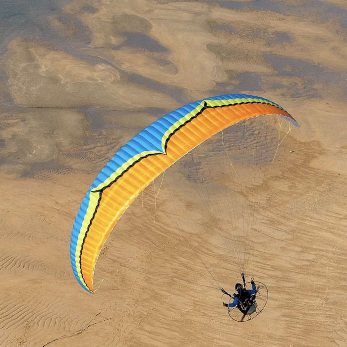 man flying parajet over the desert